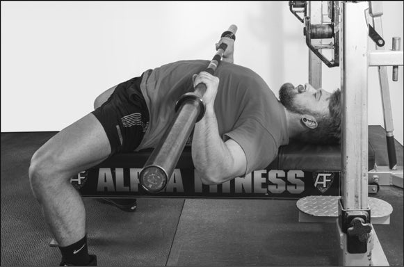 FIGURE 4.3 Barbell, wrist, and elbow alignment at the bottom of the bench press.